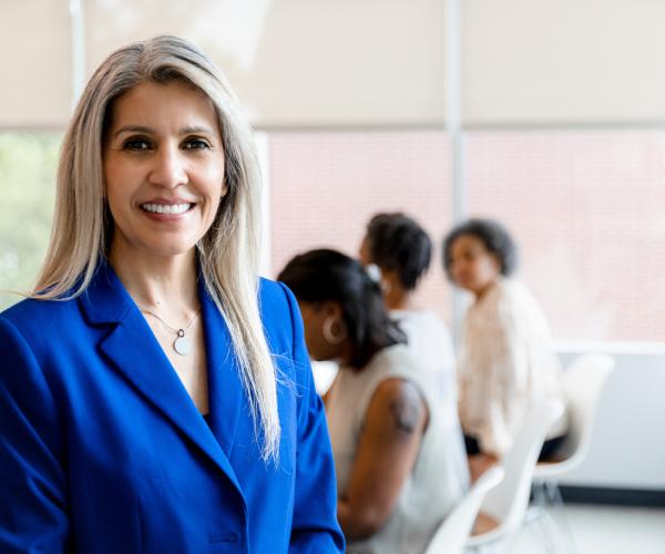 Businesswoman in conference room smiling 