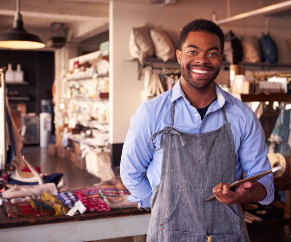 Owner of gift store with tablet 